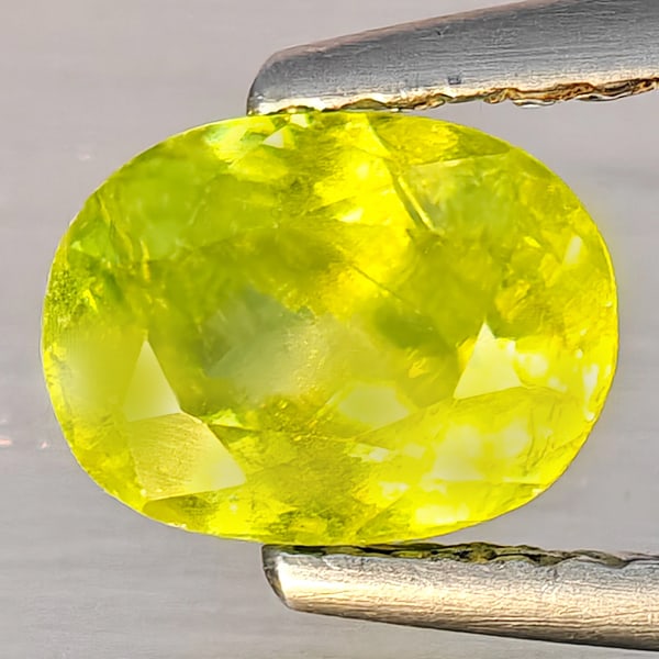 Natural Multi-Color With Rainbow Spark Sphene 1.13 Ct. Oval Shape 7.1 x 5.3 Mm Gemstone From: Product ID: 806509130 Product Name: Natural Sphene Weight: 1.13 CT. Size: 7.1 x 5.3 x 4 MM. Shape: Oval Shape Color: Multi-Color With Rainbow Spark Clarity:SI1 Luster: Good Gems Origin: Madagascar Tre