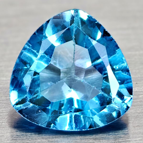 Natural Swiss Blue Topaz 3.25 Ct. Trilliant Shape 9.1 Mm Gemstone From Brazil: Product ID: 807167943 Product Name: Natural Blue Topaz Weight: 3.25 CT. Size: 9.1 x 9.1 x 5.3 MM. Shape: Trilliant Color: Swiss Blue Clarity:VSI Luster: Good Gems Origin: Brazil Treatment: Treated Cry