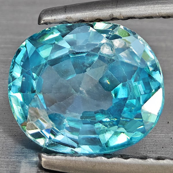 Natural Blue Zircon 2.34 Ct. Oval Shape 8.2 x 7.9 Mm Gemstone from Cambodia: Product ID: 807743055 Product Name: Natural Zircon Weight: 2.34 CT. Size: 8.2 x 7.9 x 4 MM. Shape: Oval Color: Blue Clarity:VSI Luster: Good Gems Origin: Cambodia Treatment: Heated Crystal Structure: