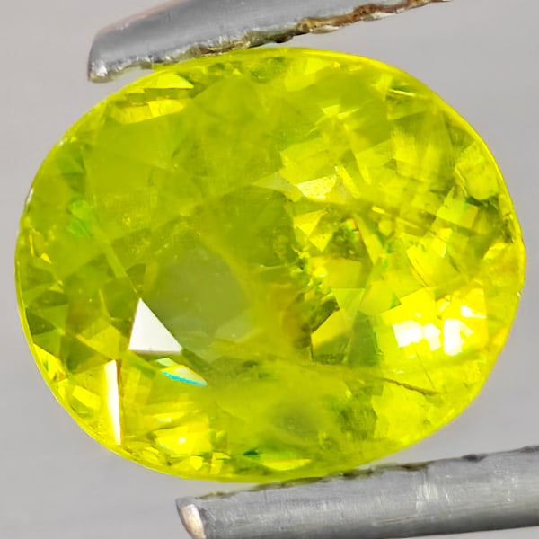 Natural Multi-Color With Rainbow Spark Sphene 1.51 Ct. Oval Shape 7.6 x 6.7 Mm Gemstone From: Product ID: 806509177 Product Name: Natural Sphene Weight: 1.51 CT. Size: 7.6 x 6.7 x 4.3 MM. Shape: Oval Shape Color: Multi-Color With Rainbow Spark Clarity:SI1 Luster: Good Gems Origin: Madagascar T