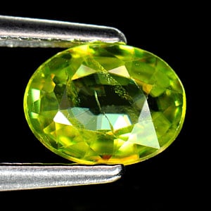 Natural Intense Green Sphene Red Spark 0.73 Ct. Oval Shape 6.6 x 5 Mm Gemstone from Madagascar (1 of 3)