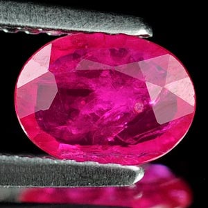 Natural Purplish Pink Ruby 0.75 Ct. Oval Shape 7.1 x 5.3 Mm Gemstone from Tanzania: Product ID: 805927007 Product Name: Natural Ruby Weight: 0.75 CT. Size: 7.1 x 5.3 x 2 MM. Shape: Oval Color: Purplish Pink Clarity:VSI Luster: Good Gems Origin: Tanzania Treatment: Unheated Crystal St