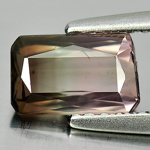 Natural Bi Color Tourmaline 1.04 Ct. Octagon Shape 7.5 x 4.6 Mm. Gemstone from Nigeria: Product ID: 807244092 Product Name: Natural Tourmaline Weight: 1.04 CT. Size: 7.5 x 4.6 x 3.1 MM. Shape: Octagon Color: Bi Color Clarity:SI1 Luster: Good Gems Origin: Nigeria Treatment: Unheated Cryst