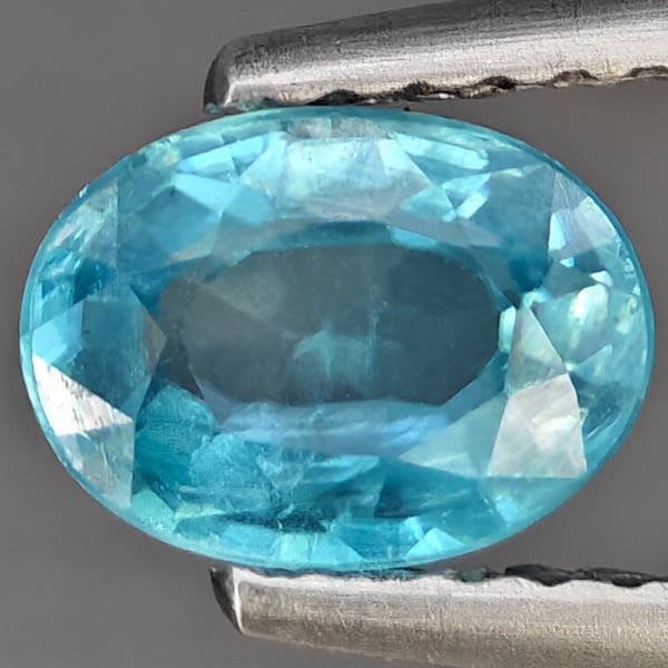 Natural Blue Zircon 1.34 Ct. Oval Shape 7 x 5.2 Mm Gemstone from Cambodia: Product ID: 807743215 Product Name: Natural Tanzanite Weight: 1.34 CT. Size: 7 x 5.2 x 3.2 MM. Shape: Oval Shape Color: Blue Clarity:SI1 Luster: Good Gems Origin: Cambodia Treatment: Heated Crystal St