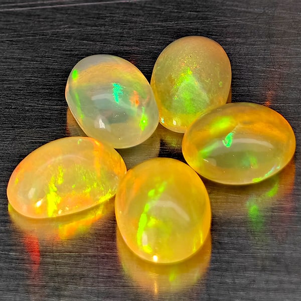 Natural Multi Color Opal 2.33 Ct. 5 Pcs Oval Cabochon Shape 6.3 x 4.2 Mm Gemstones From Ethiopia: Product ID: 818728422 Product Name: Natural Opal Weight: 2.33 CT. Size: 6.3 x 4.2 x 3.2 MM. Shape: Oval Cabochon Color: Multi-Color Clarity:Semi - Transparent Luster: Good Gems Origin: Ethiopia Treatm