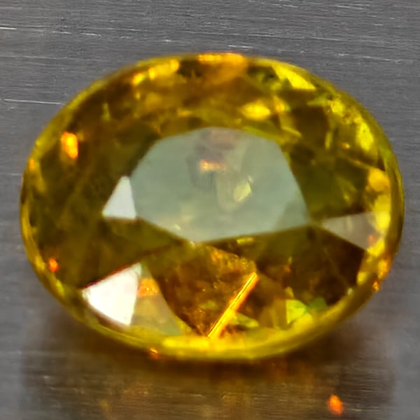Natural Multi Color Titanium Rainbow Spark Sphene Gemstones 2.06 Ct. Oval Shape 8.4 x 7 Mm: Product ID: 806509062 Product Name: Natural Sphene Weight: 2.06 CT. Size: 8.4 x 7 x 4.5 MM. Shape: Oval Color: Multi-Color Clarity:SI1 Luster: Good Gems Origin: Madagascar Treatment: Unheated Crystal 