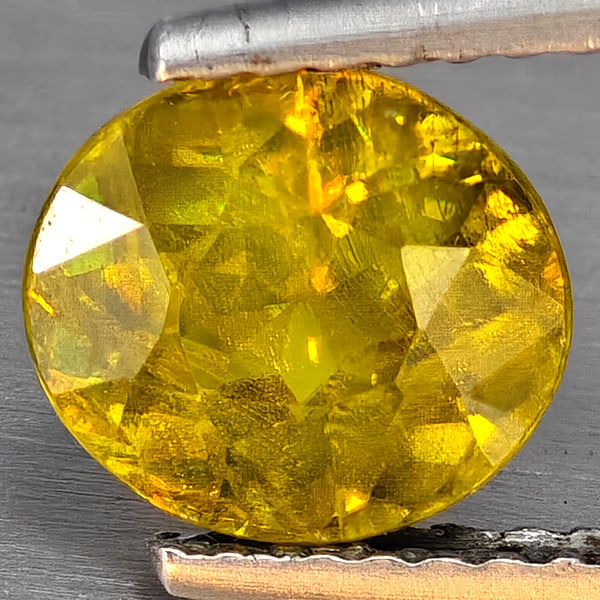 Natural Multi-Color With Rainbow Spark Sphene Gemstones 1.72 Ct. Oval Shape 7.6 x 7.8 Mm: Product ID: 806509108 Product Name: Natural Sphene Weight: 1.72 CT. Size: 7.6 x 7.8 x 4.4 MM. Shape: Oval Shape Color: Multi-Color Clarity:SI1 Luster: Good Gems Origin: Madagascar Treatment: Unheated 