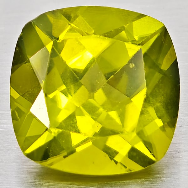 Natural Green Peridot Gemstone 1.52 Ct. Cushion Shape 7.2 Mm.: Product ID: 805317225 Product Name: Natural Peridot Weight: 1.52 CT. Size: 7.2 x 7.2 x 4.4 MM. Shape: Cushion Shape Color: Green Clarity:VSI - SI1 Luster: Good Gems Origin: Pakistan Treatment: Unheate