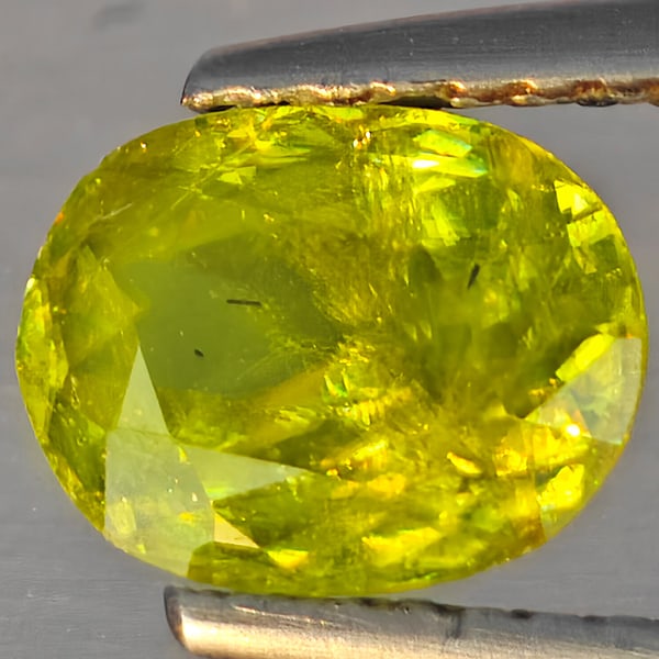 Natural Multi-Color With Rainbow Spark Sphene 1.32 Ct. Oval Shape 7.8 x 6 Mm Gemstone From: Product ID: 806509236 Product Name: Natural Sphene Weight: 1.32 CT. Size: 7.8 x 6 x 3.8 MM. Shape: Oval Shape Color: Multi-Color Clarity:SI1 Luster: Good Gems Origin: Madagascar Treatment: Unheated Cr