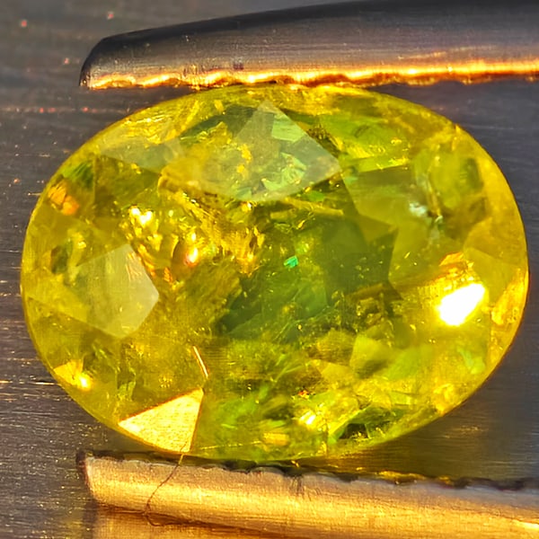 Natural Multi-Color With Rainbow Spark Sphene 1.37 Ct. Oval Shape 7.8 x 5.9 Mm Gemstone From: Product ID: 806509241 Product Name: Natural Sphene Weight: 1.37 CT. Size: 7.8 x 5.9 x 4 MM. Shape: Oval Shape Color: Multi-Color Clarity:SI1 Luster: Good Gems Origin: Madagascar Treatment: Unheated Cr