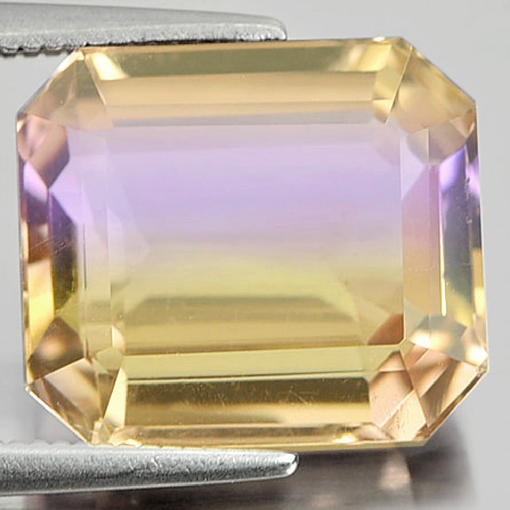 Natural Bi Color Ametrine 7.85 Ct Octagon Shape 12.6 x 11.1 Mm Gemstone from Bolivia: Product ID: 800407234 Product Name: Natural Ametrine Weight: 7.85 CT. Size: 12.6 x 11.1 x 6.8 MM. Shape: Octagon Color: Bi-Color Clarity:VSI Luster: Good Gems Origin: Bolivia Treatment: Unheated Cryst