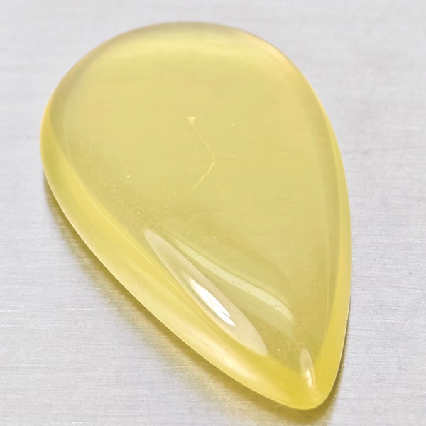 Natural Yellow Lemon Quartz 16.91 Ct. Pear Cabochon Shape 25 x 15.3 Mm Gemstone From Brazil: Product ID: 805530059 Product Name: Natural Quartz Weight: 16.91 CT. Size: 52 x 15.3 x 6.3 MM. Shape: Pear Cabochon Color: Yellow Clarity:None Luster: Good Gems Origin: Brazil Treatment: Unheated Crys