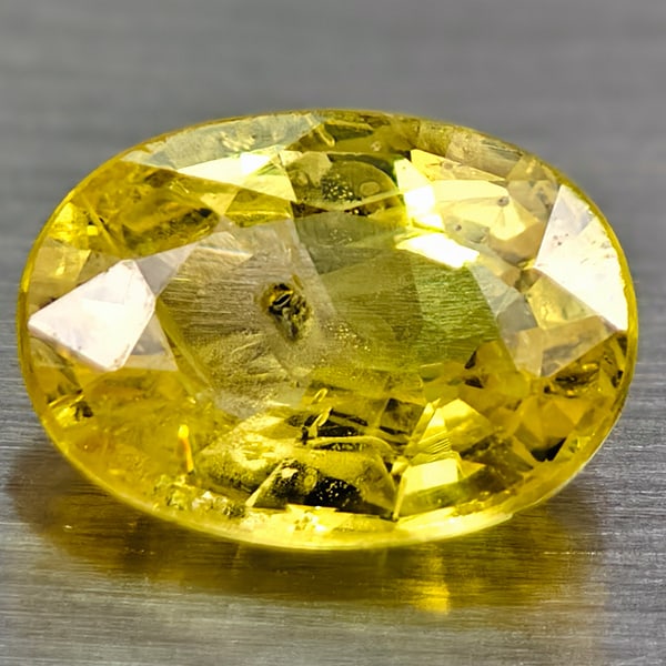 Natural Yellow Color Sapphire 0.97 Ct. Oval Shape 6.8 x 4.9 Mm Gemstone From Thailand: Product ID: 106116095 Product Name: Natural Yellow Sapphire Weight: 0.97 CT. Size: 6.8 X 4.9 X 2.9 MM. Shape: Oval Color: Yellow Clarity:SI Luster: Good Gems Origin: Thailand Treatment: Heated Crystal