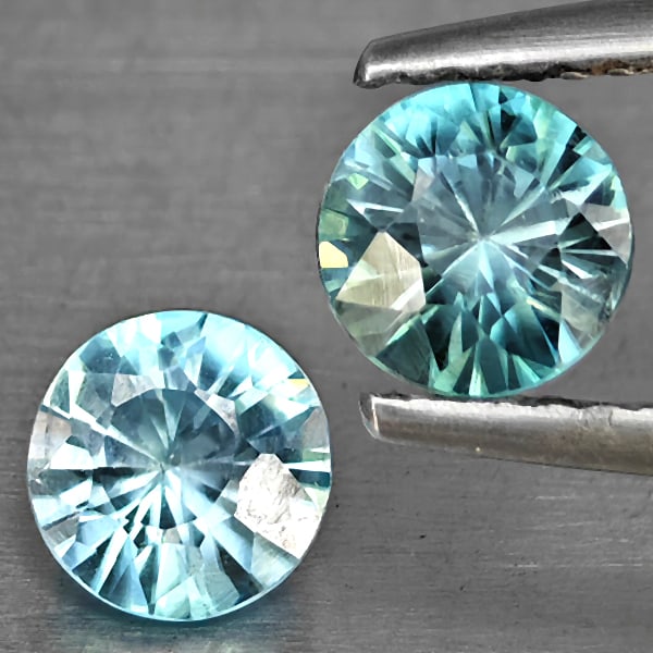 Natural Blue Zircon 1.39 Ct. 2 Pcs Round Diamond Cut 5.2 Mm Gemstone from Cambodia: Product ID: 807743264 Product Name: Natural Gemstones Weight: 1.39 CT. Size: 5.2 x 5.2 x 3.3 MM. Shape: Round Diamond Cut Color: Blue Clarity:SI1 Luster: Good Gems Origin: Cambodia Treatment: Heated C