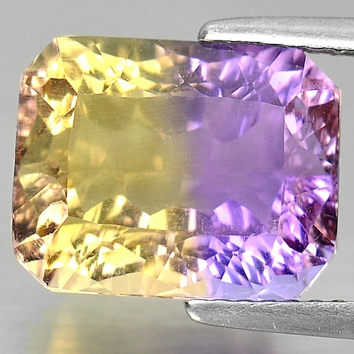 Natural Bi Color Ametrine 6.06 Ct. Octagon Millennium Cut 12 x 9.5 Mm Gemstone From Bolivia: Product ID: 800408013 Product Name: Natural Ametrine Weight: 6.06 CT. Size: 12 x 9.5 x 7.2 MM. Shape: Octagon Millennium Cut Color: Bi Color Clarity:IF Luster: Very Good Gems Origin: Bolivia Treatment