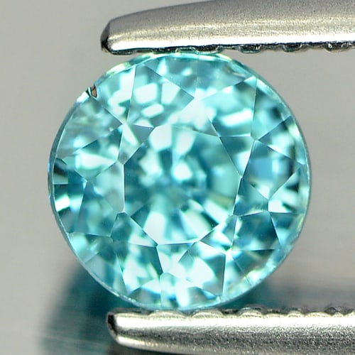 Natural Blue Zircon 1.07 Ct. Round Shape 5.3 Mm Gemstone from Cambodia: Product ID: 807727617 Product Name: Natural Zircon Weight: 1.07 CT. Size: 5.3 x 5.3 x 4.3 MM. Shape: Round Color: Blue Clarity:VSI Luster: Good Gems Origin: Cambodia Treatment: Heated Crystal Structur