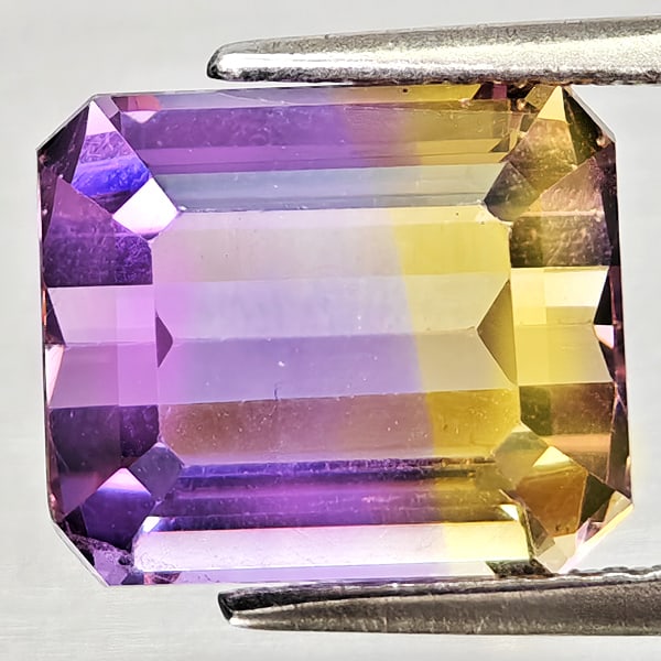 Natural Bi Color Ametrine 4.89 Ct. Octagon Shape 10.3 x 8.3 Mm Gemstone From Bolivia: Product ID: 800408273 Product Name: Natural Ametrine Weight: 4.89 CT. Size: 10.3 x 8.3 x 7.1 MM. Shape: Octagon Color: Bi Color Clarity:VSI - SI1 Luster: Good Gems Origin: Bolivia Treatment: Unheated 
