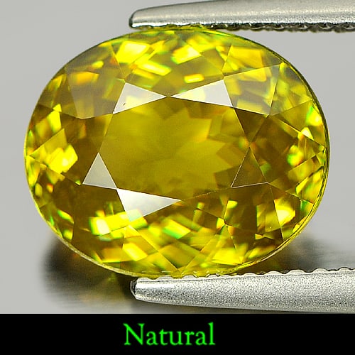 Natural Multi Color Titanium With Rainbow Spark Sphene Gemstones 4.47 Ct. Oval Shape: Product ID: 806507134 Product Name: Natural Sphene Weight: 4.47 CT. Size: 11 x 9.1 x 5.6 MM. Shape: Oval Color: Multi Color With Rainbow Spark Clarity:VSI Luster: Adamantine Gems Origin: Madagascar Tr