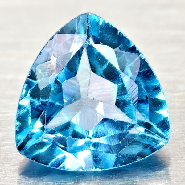 Natural Swiss Blue Topaz Gemstones 4.31 Ct. Trilliant Shape 10 Mm.: Product ID: 807167938 Product Name: Natural Blue Topaz Weight: 4.31 CT. Size: 10 x 10 x 6.1 MM. Shape: Trilliant Color: Swiss Blue Clarity:VSI Luster: Good Gems Origin: Brazil Treatment: Treated Cryst
