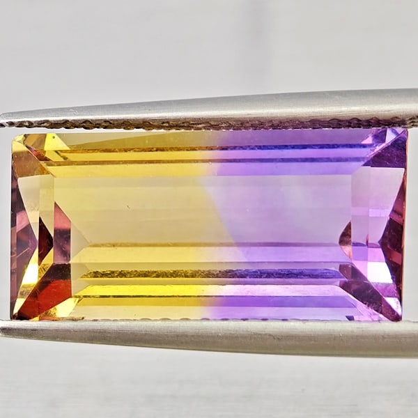 Natural Bi Color Ametrine Gemstones 7.08 Ct. Baguette Shape 17.8 x 8.5 Mm.: Product ID: 800408565 Product Name: Natural Ametrine Weight: 7.08 CT. Size: 17.8 x 8.5 x 6.4 MM. Shape: Baguette Color: Bi Color Clarity:VSI Luster: Good Gems Origin: Bolivia Treatment: Unheated Cryst