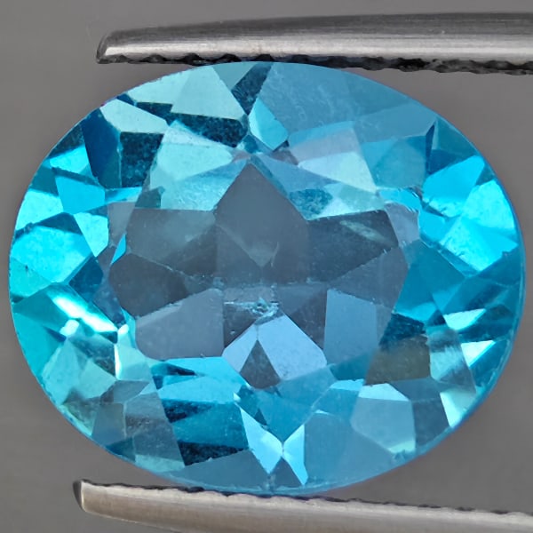 Natural Gem Swiss Blue Topaz Gemstones 6.03 Ct. Oval Shape 12.2 x 10.3 Mm.: Product ID: 807169025 Product Name: Natural Blue Topaz Weight: 6.03 CT. Size: 12.2 x 10.3 x 6.5 MM. Shape: Oval Shape Color: Swiss Blue Clarity:VSI Luster: Good Gems Origin: Brazil Treatment: Treated 