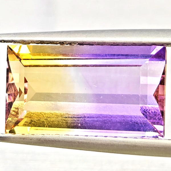 Natural Bi Color Ametrine Gemstones 4.73 Ct. Baguette Shape 14.2 x 8.1 Mm.: Product ID: 800408568 Product Name: Natural Ametrine Weight: 4.73 CT. Size: 14.2 x 8.1 x 5.3 MM. Shape: Baguette Color: Bi Color Clarity:VSI Luster: Good Gems Origin: Bolivia Treatment: Unheated Cryst