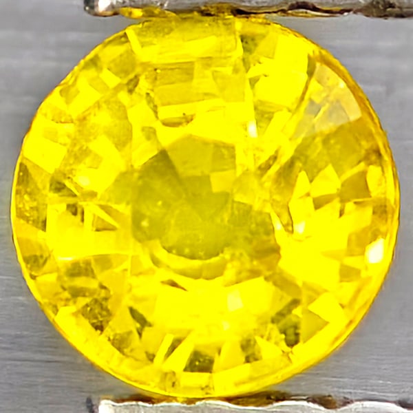 Natural Yellow Sapphire Gemstones 0.47 Ct. Round Shape 4.3 Mm.: Product ID: 806162950 Product Name: Natural Yellow Sapphire Weight: 0.47 CT. Size: 4.3 x 4.3 x 2.7 MM. Shape: Round Shape Color: Yellow Clarity:VSI Luster: Good Gems Origin: Thailand Treatment: Heated