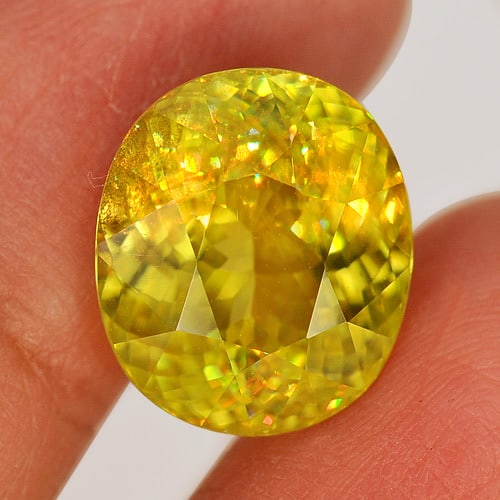 Natural Multi Color Titanium Sphene Rainbow Spark 8.43 Ct. Oval 13.4 x 11.6 Mm.: Product ID: 806507468 Product Name: Natural Sphene Weight: 8.43 CT. Size: 13.4 x 11.6 x 7.3 MM. Shape: Oval Color: Multi Color With Rainbow Spark Clarity:VSI Luster: Adamantine Gems Origin: Madagascar