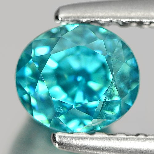 Natural Blue Color Zircon Gemstones 1.33 Ct. Oval Shape 5.3 x 4.7 Mm.: Product ID: 807712249 Product Name: Natural Zircon Weight: 1.33 CT. Size: 5.3 x 4.7 x 5 MM. Shape: Oval Color: Blue Clarity:VSI Luster: Good Gems Origin: Cambodia Treatment: Heated Crystal Structure: 