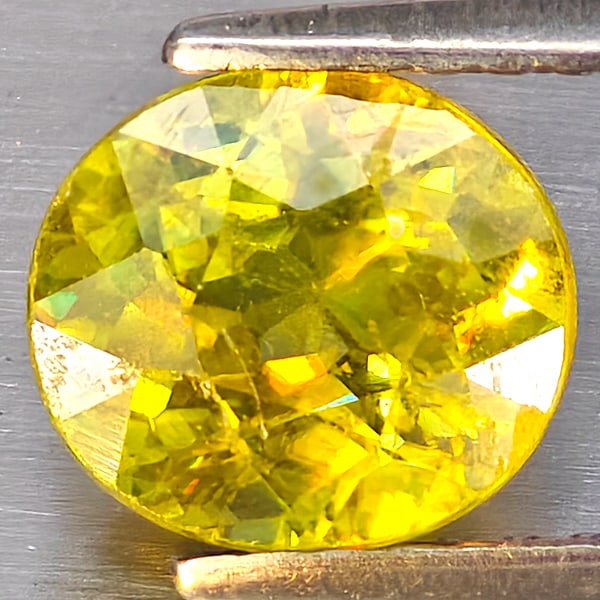 Natural Multi Color Titanium Rainbow Spark Sphene Gemstones 1.54 Ct. Oval Shape 7.2 x 6.7 Mm.: Product ID: 806509081 Product Name: Natural Sphene Weight: 1.54 CT. Size: 7.2 x 6.7 x 4.5 MM. Shape: Oval Color: Multi-Color Clarity:SI1 Luster: Good Gems Origin: Madagascar Treatment: Unheated Crysta