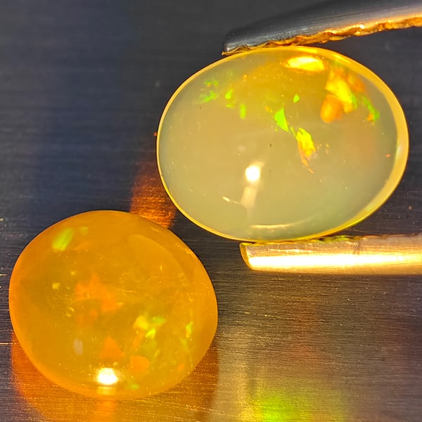 Natural Multi-Color Play Of Colour Opal Gemstones 1.32 Ct. 2 Pc. Oval Cabochon Shape 7.5 x 5.7 Mm.: Product ID: 818728319 Product Name: Natural Opal Weight: 1.32 CT. Size: 7.5 x 5.7 x 4 MM. Shape: Oval Cabochon Color: Multi-Color Clarity:None Luster: Good Gems Origin: Ethiopia Treatment: Unheated Cr