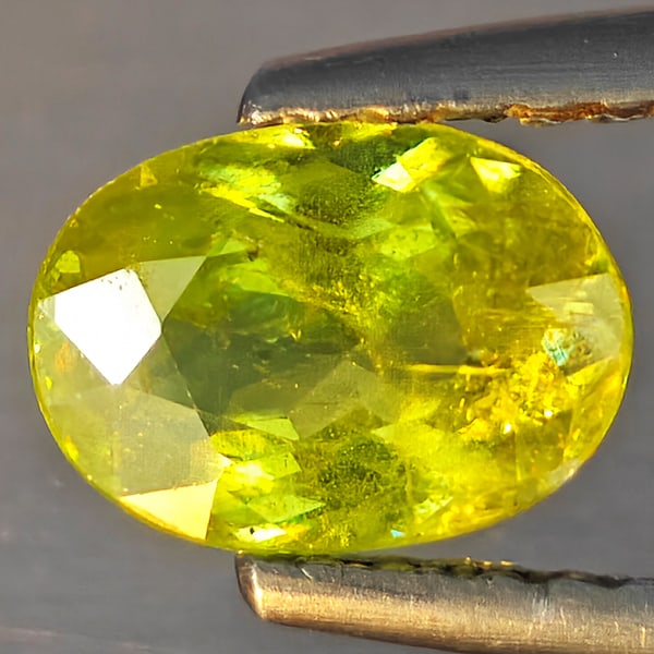 Natural Multi-Color With Rainbow Spark Sphene Gemstones 0.89 Ct. Oval Shape 7.2 x 5.2 Mm.: Product ID: 806509185 Product Name: Natural Sphene Weight: 0.89 CT. Size: 7.2 x 5.2 x 3.3 MM. Shape: Oval Shape Color: Multi-Color Clarity:SI1 Luster: Good Gems Origin: Madagascar Treatment: Unheated 
