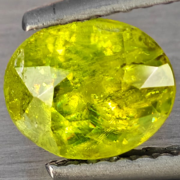 Natural Multi-Color With Rainbow Spark Sphene Gemstones 1.49 Ct. Oval Shape 7.2 x 6 Mm.: Product ID: 806509190 Product Name: Natural Sphene Weight: 1.49 CT. Size: 7.2 x 6 x 4.9 MM. Shape: Oval Shape Color: Multi-Color Clarity:SI1 Luster: Good Gems Origin: Madagascar Treatment: Unheated Cr