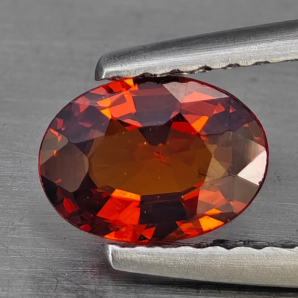Natural Reddish Orange Spessartine Garnet Gemstones 0.76 Ct. Oval Shape 6.8 x 5 Mm.: Product ID: 802936378 Product Name: Natural Spessartine Weight: 0.76 CT. Size: 6.8 x 5 x 2.6 MM. Shape: Oval Color: Orange Clarity:VSI Luster: Good Gems Origin: Nigeria Treatment: Unheated Crystal Str