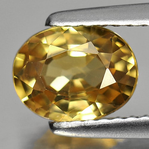 Natural Yellow Zircon Gemstone 1.73 Ct. Oval Shape 7.8 x 6 Mm.: Product ID: 807727819 Product Name: Natural Zircon Weight: 1.73 CT. Size: 7.8 x 6 x 3.5 MM. Shape: Oval Color: Yellow Clarity:VSI Luster: Good Gems Origin: Cambodia Treatment: Heated Crystal Structure
