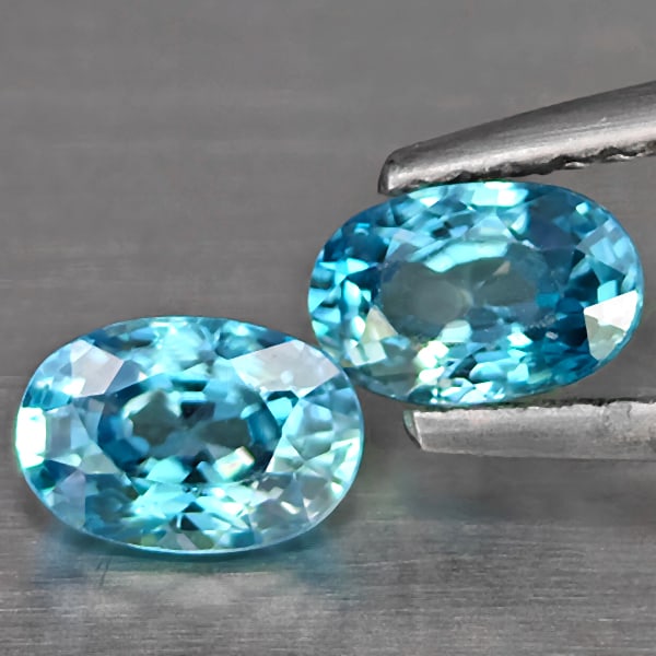 Natural Blue Zircon Gemstones 1.59 Ct. 2 Pcs. Oval Shape 6.1 x 4 Mm.: Product ID: 807725467 Product Name: Natural Zircon Weight: 1.59 CT. Size: 6.1 x 4 x 3.1 MM. Shape: Oval Shape Color: Blue Clarity:SI1 Luster: Good Gems Origin: Cambodia Treatment: Heated Crystal Struc