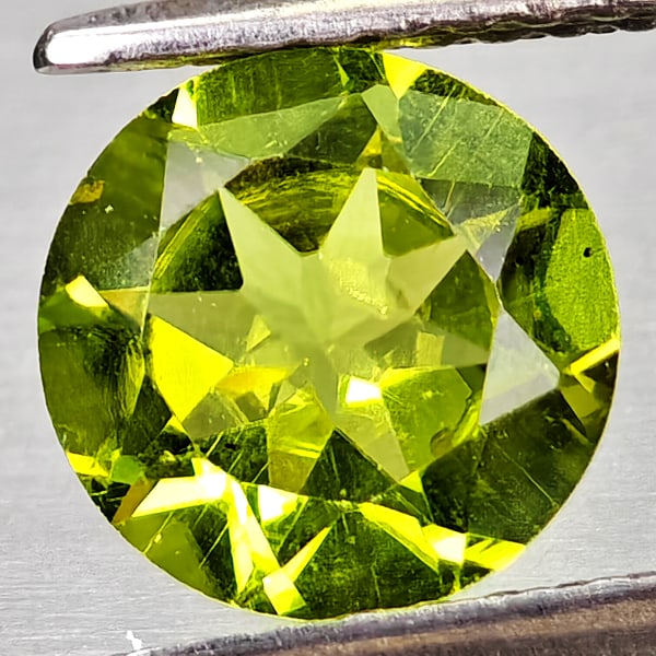 Natural Green Peridot Gemstones 1.41 Ct. Round Shape 7 Mm.: Product ID: 805317207 Product Name: Natural Peridot Weight: 1.41 CT. Size: 7 x 7 x 4 MM. Shape: Round Color: Green Clarity:VSI Luster: Good Gems Origin: Pakistan Treatment: Unheated Crystal Structure: