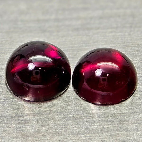 Natural Purplish Pink Rhodolite Garnet Gemstones 1.52 Ct. 2 Pcs. Round Cabochon Shape 5 Mm.: Product ID: 802936764 Product Name: Natural Rhodolite Weight: 1.52 CT. Size: 5 x 5 x 2.9 MM. Shape: Round Cabochon Color: Purplish Pink Clarity:Semi - Transparent Luster: Good Gems Origin: Madagascar 