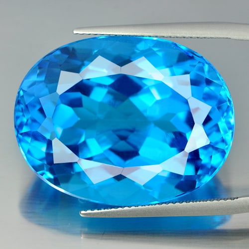 Natural Swiss Blue Topaz Gemstones 66.40 Ct. Clean Oval Shape 28 x 21 Mm.: Product ID: 807155590 Product Name: Natural Blue Topaz Weight: 66.40 CT. Size: 28 x 21 x 14.8 MM. Shape: Oval Color: Swiss Blue Clarity:IF Luster: Very Good Gems Origin: Brazil Treatment: Treated Crys