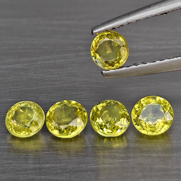 Natural Greenish Yellow Titanium Sphene Gemstones Rainbow Spark 1.60 Ct. 5 Pcs. Round Shape 4.2 Mm.: Product ID: 806509370 Product Name: Natural Sphene Weight: 1.60 CT. Size: 4.2 x 4.2 x 2.3 MM. Shape: Round Color: Greenish Yellow Clarity:SI1 Luster: Good Gems Origin: Madagascar Treatment: Unheated C