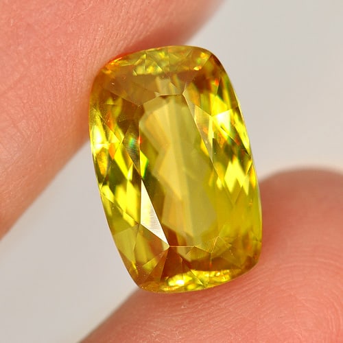 Natural Multi Color Titanium Sphene Gemstones With Rainbow Spark 7.05 Ct. Cushion Shape 13.6 x 8.7: Product ID: 806507473 Product Name: Natural Sphene Weight: 7.05 CT. Size: 13.6 x 8.7 x 6.4 MM. Shape: Cushion Color: Multi Color With Rainbow Spark Clarity:VVS Luster: Adamantine Gems Origin: Madagasc