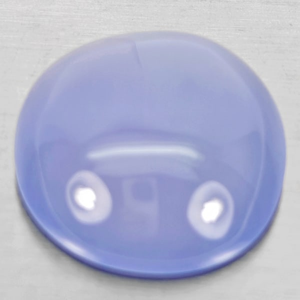 Natural Lavender Chalcedony Gemstones 26.82 Ct. Oval Cabochon Shape 22 x 20 Mm.: Product ID: 801502702 Product Name: Natural Chalcedony Weight: 26.82 CT. Size: 22 x 20 x 8.5 MM. Shape: Oval Cabochon Color: Lavender Clarity:Semi - Transparent Luster: Good Gems Origin: Russia Treatm