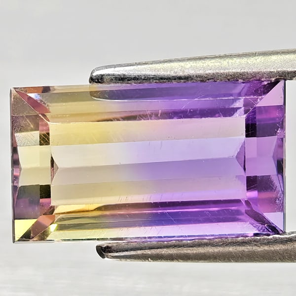 Natural Bi Color Ametrine Gemstones 2.86 Ct. Octagon Shape 10.9 x 6.3 Mm.: Product ID: 800408394 Product Name: Natural Ametrine Weight: 2.86 CT. Size: 10.9 x 6.3 x 5.1 MM. Shape: Octagon Color: Bi Color Clarity:VSI - SI1 Luster: Good Gems Origin: Bolivia Treatment: Unheated 