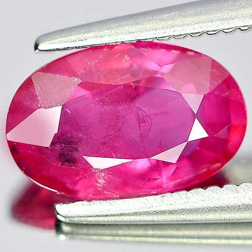 Natural Purplish Pink Ruby Gemstones 1.79 Ct. Oval Shape 8.4 x 6.1 Mm.: Product ID: 805920490 Product Name: Natural Ruby Weight: 1.79 CT. Size: 8.8 x 5.7 x 3.6 MM. Shape: Oval Color: Purplish Pink Clarity:VSI Luster: Good Gems Origin: Mozambique Treatment: Heated (Lead-gl