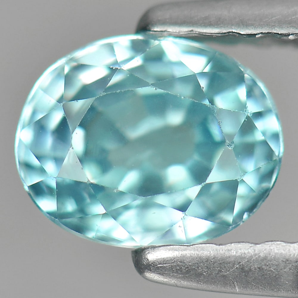 Natural Blue Zircon Gemstones 1.32 Ct. Oval Shape 6.5 x 5.2 Mm.: Product ID: 807730786 Product Name: Natural Zircon Weight: 1.32 CT. Size: 6.5 x 5.2 x 3.7 MM. Shape: Oval Color: Blue Clarity:VSI Luster: Good Gems Origin: Cambodia Treatment: Heated Crystal Structure