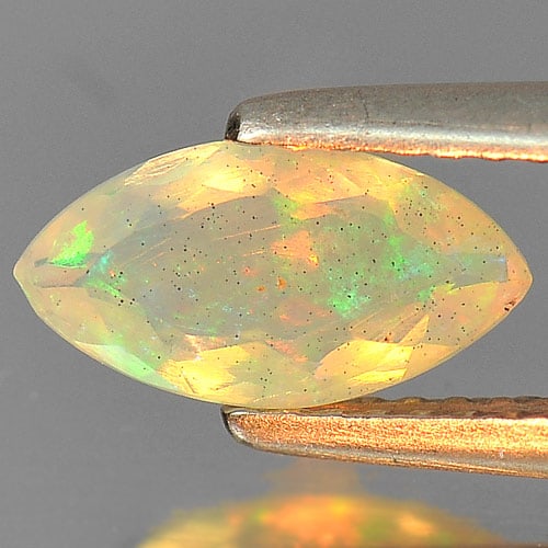 Natural Multi Color Play Of Colour Opal Gemstones 0.59 Ct. Marquise Shape 9.8 x 5.2 Mm.: Product ID: 818726145 Product Name: Natural Opal Weight: 0.59 CT. Size: 9.8 x 5.2 x 3 MM. Shape: Marquise Color: Multi Color Clarity:Semi - Transparent Luster: Iridescent Gems Origin: Ethiopia Treatme