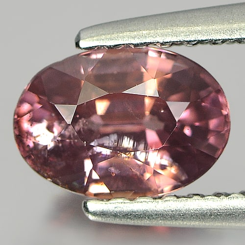 Natural Imperial Pink Zircon Gemstones 1.35 Ct. Oval Shape 7.3 x 5.2 Mm.: Product ID: 807719649 Product Name: Natural Zircon Weight: 1.35 CT. Size: 7.3 x 5.2 x 3.9 MM. Shape: Oval Color: Imperial Pink Clarity:SI Luster: Good Gems Origin: Tanzania Treatment: Unheated Crystal