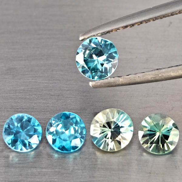 Natural Blue Zircon Gemstones 2.39 Ct. 5 Pcs. Round Diamond Cut: Product ID: 807743244 Product Name: Natural Zircon Weight: 2.39 CT. Size: 4.8 x 4.8 x 2.8 to 4.4 x 4.4 x 2.8 MM. Shape: Round Diamond Cut Color: Blue Clarity:SI1 Luster: Good Gems Origin: Cambodia Tre