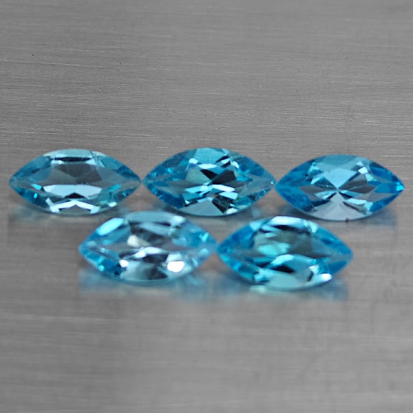 Natural Swiss Blue Topaz Gemstones 6.12 Ct. 5 Pcs. Marquise Shape 10 x 5.2 Mm.: Product ID: 807168714 Product Name: Natural Blue Topaz Weight: 6.12 CT. Size: 10 x 5.2 x 3.2 MM. Shape: Marquise Shape Color: Swiss Blue Clarity:VSI Luster: Good Gems Origin: Brazil Treatment: Treated