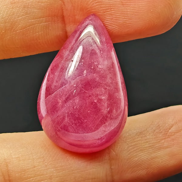 Natural Pink Red Ruby Gemstones 36.19 Ct. Pear Cabochon Shape 24 x 16 Mm.: Product ID: 805935299 Product Name: Natural Ruby Weight: 36.19 CT. Size: 24 x 16 x 9.4 MM. Shape: Pear Cabochon Color: Pinkish Red Clarity:Opaque Luster: Good Gems Origin: Madagascar Treatment: Heated